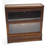 A Globe Wernicke oak two section bookcase, with original label,