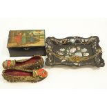 A pair of decorative 19th Century shoes, a Russian papier mache box,