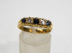 A sapphire and diamond five stone carved half hoop ring, stamped '18ct'. 5.