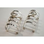 A pair of small silver toast racks, makers R&S, Birmingham 1936, of four divisions, 7.