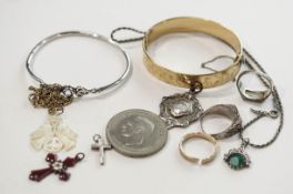 A small collection of costume jewellery, including a silver ring,