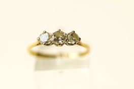 A three stone diamond 18 carat gold ring, the graduated brilliant cuts totalling approximately 0.