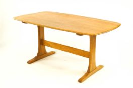 A 20th Century Ercol elm and beech dining table,