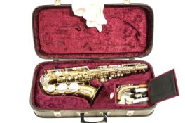 A gilt metal Saxophone, by Rosehill Instruments, serial Number 133703,