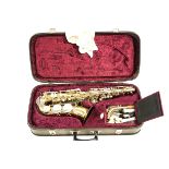 A gilt metal Saxophone, by Rosehill Instruments, serial Number 133703,