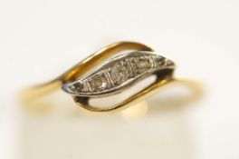 A five stone diamond ring, stamped '18ct', set with graduated single ad rose cut stones,