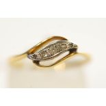 A five stone diamond ring, stamped '18ct', set with graduated single ad rose cut stones,