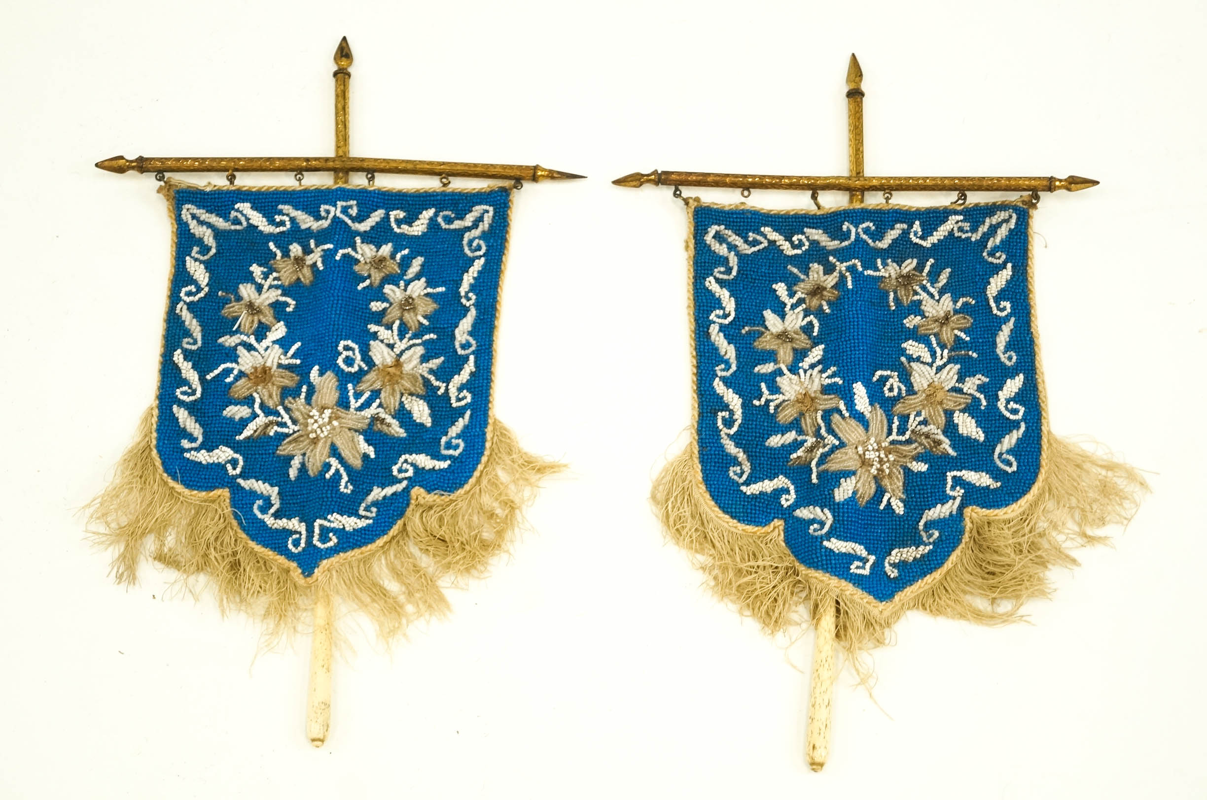 A pair of Victorian shield shaped beaded face screens,