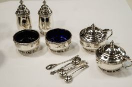 A matched six piece silver Lindisfarne pattern cruet set, by Reid & Son of Newcastle Upon Tyne,