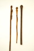 Three African carved walking sticks