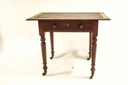 A Victorian mahogany writing table with single drawer and leather inset surface,