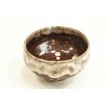 A Cornish Studio Pottery footed bowl, with brown glaze, impressed monogram to base,