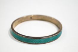 An early 20th Century silver and pale green guilloche enamelled slave bangle,
