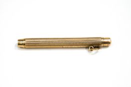 A 9 carat gold Sampson Mordan & Co propelling pencil, London 1926, with engine turned decoration,