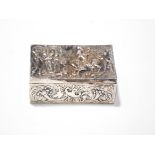 A late 19th century Dutch silver box, the cover embossed with a swordsman on horseback and figures,