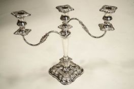 A silver plated three light candelabrum, square shaped base, reeded branches, 35.