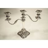 A silver plated three light candelabrum, square shaped base, reeded branches, 35.