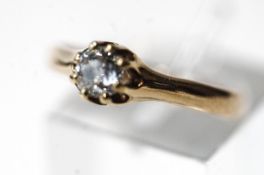 A single stone diamond ring, stamped '14K, the olds cut brilliant of approximately 0.