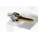 A single stone diamond ring, stamped '14K, the olds cut brilliant of approximately 0.