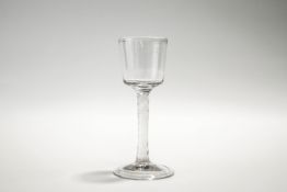 An 18th Century wine glass,