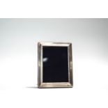 A silver photograph frame, Sheffield 1997, 15.2 cm high by 11.5 cm wide, image area 8.