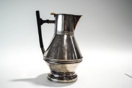 A Mappin & Webb electroplated water jug, after a design by Christopher Dresser,