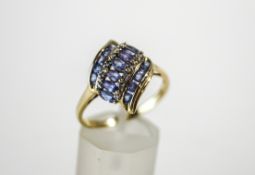 A 9 carat gold Tanzanite cluster ring, the stones running diagonally, finger size U1/2,