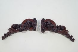 A pair of Victorian carved mahogany furniture brackets/mounts,