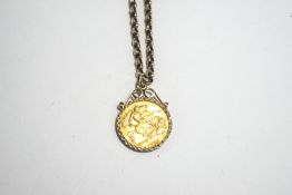 A 1915 half Sovereign, in a 9 carat gold diamond cut scroll top pendant mount on a chain, 8.