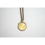 A 1915 half Sovereign, in a 9 carat gold diamond cut scroll top pendant mount on a chain, 8.