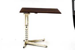 A late 19th Century cast iron adjustable reading table, by Wincycle Trading Co, with label,