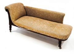A Victorian mahogany Chaise Longue, with carved detail,