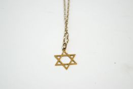 A Star of David pendant, stamped '375', on a chain, 2.