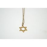 A Star of David pendant, stamped '375', on a chain, 2.