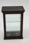 A late Victorian/Edwardian mahogany shop display cabinet, enclosing two glass shelves,
