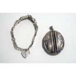A late Victorian large oval silver locket, unmarked,