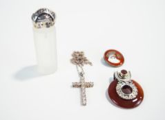 A silver and white stone cross with chain, a silver Mambo ring, a Cornelian and silver pendant,