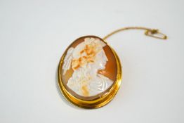 A late Victorian shell cameo brooch, tagged '9ct', to a plain mount, 4.4 cm by 3.6 cm, 12.