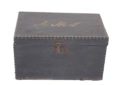 A small canvas travelling trunk, with brass studding and initials,