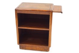 A 1950's mahogany shelved writing unit, with leather surface and slide out support,
