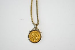 A 1900 half Sovereign, to a 9 carat gold scroll top pendant mount, on a fox tail link chain, 12.