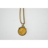 A 1900 half Sovereign, to a 9 carat gold scroll top pendant mount, on a fox tail link chain, 12.