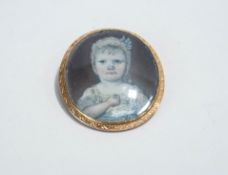 A late 18th Century miniature portrait brooch, the image of a young child to a prick dot mount,