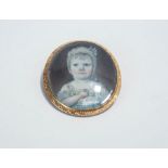 A late 18th Century miniature portrait brooch, the image of a young child to a prick dot mount,