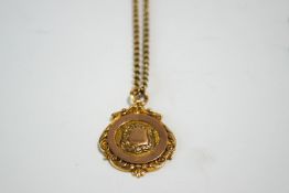 A 9 carat gold fob/pendant, on a gold chain of round belcher links, 17.