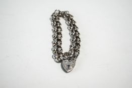 A silver bracelet, of double filed curb links, to a padlock clasp, 19.
