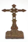 A Victorian cast iron cross, possibly from a church roof,