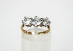 A three stone ring, stamped,