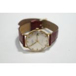 Rotary, a 9 carat gold gentleman's wrist watch, the circular white dial with glt batons, hands,