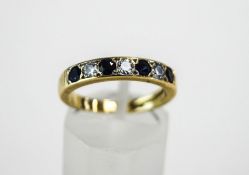 An 18 carat gold seven stone sapphire and diamond half hoop ring,